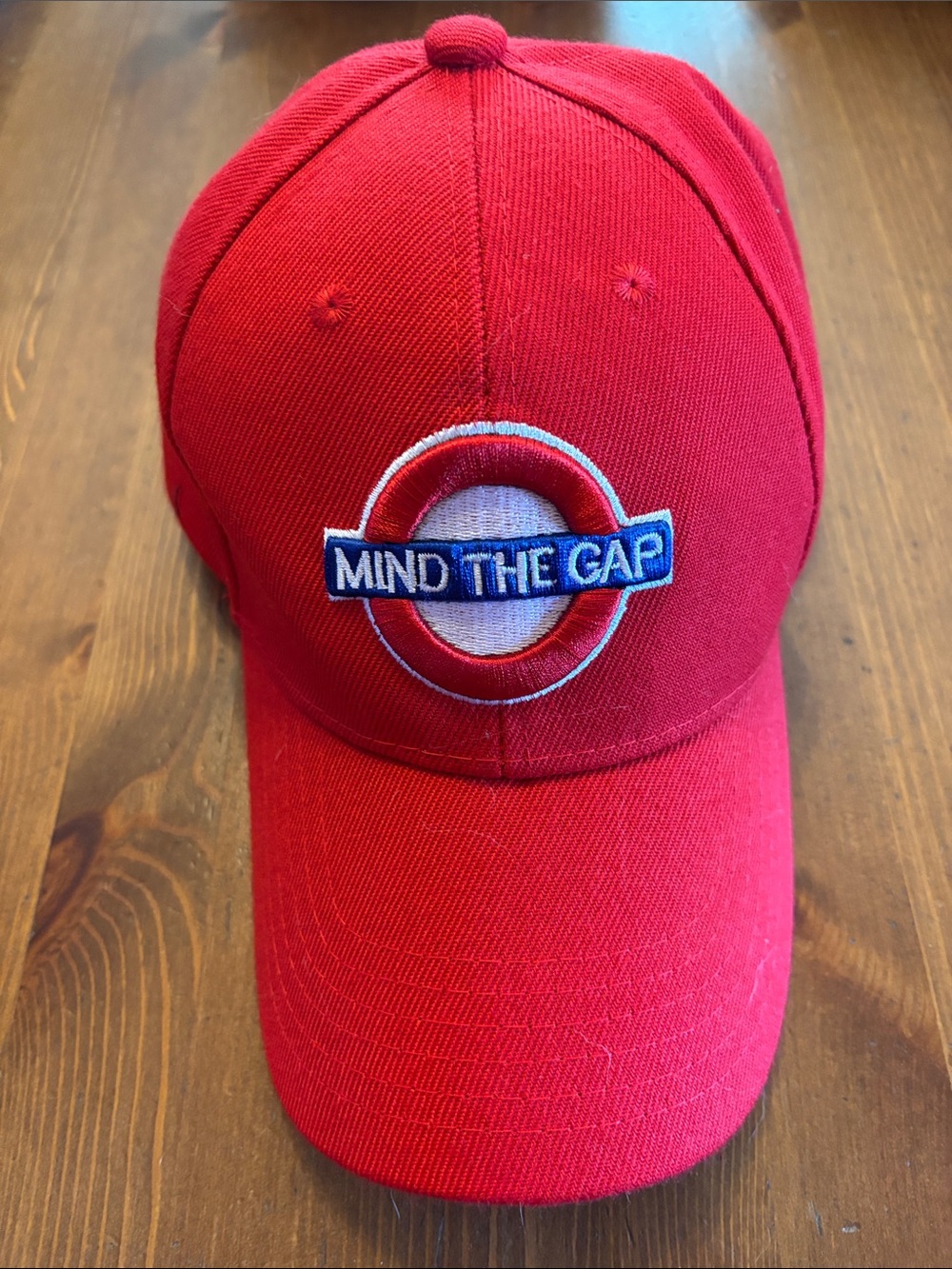 Red "Mind The Gap" Embroidered Baseball Cap
